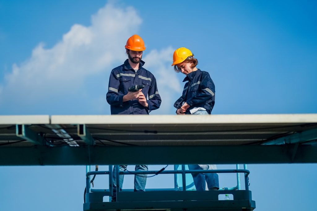 engineer service check installation solar cell on the roof of factory technician checks solar cell 1024x682 1