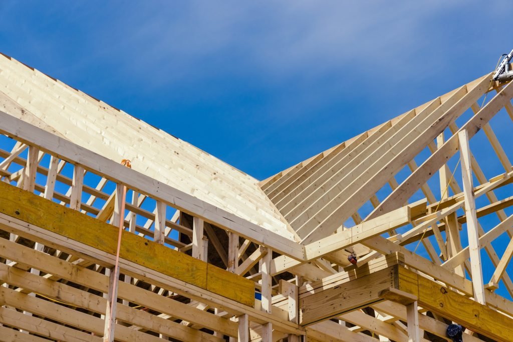 new residential construction home framing with a roof view 1024x682 1