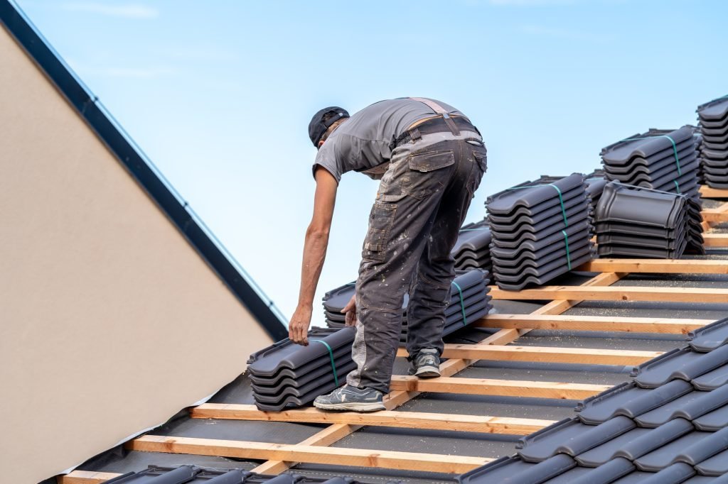 new roof of a family house a roofer builds a roof made of ceramic tiles 1024x682 1